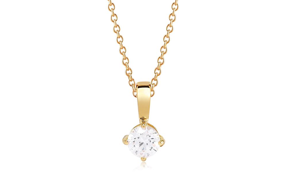 Gold necklace with a diamond pendant on a white background
