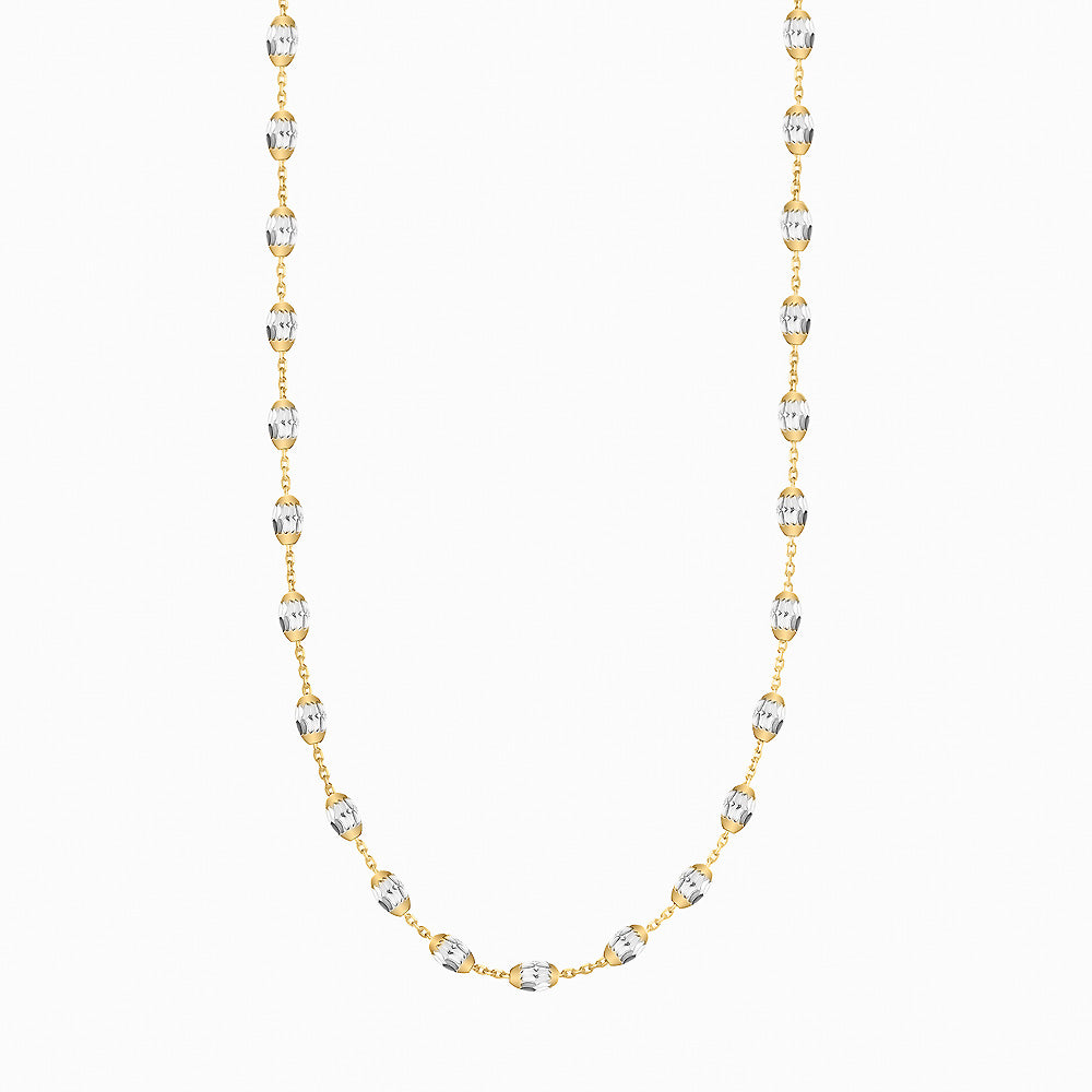 Gold and silver beaded necklace on a white background