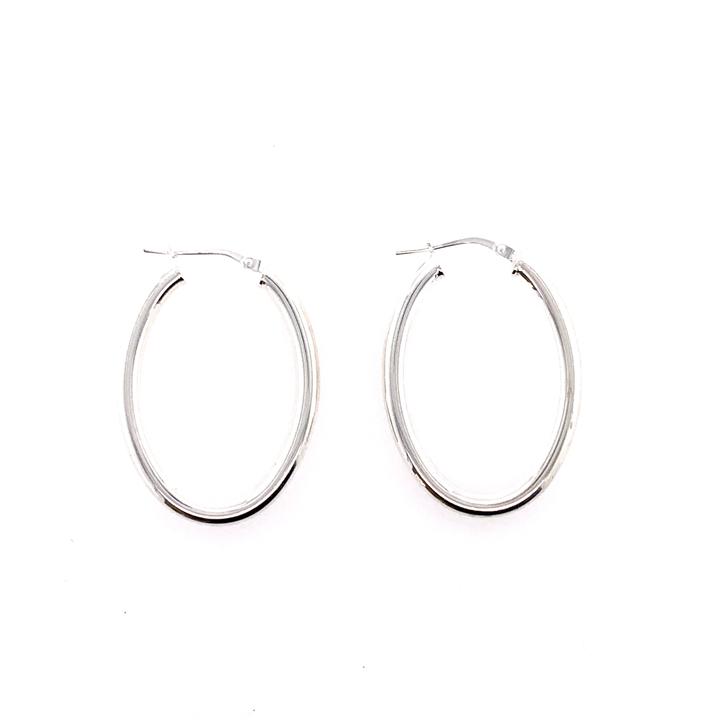 Pair of silver hoop earrings on a white background