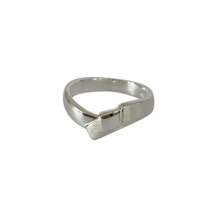 Silver ring with a unique design on a white background