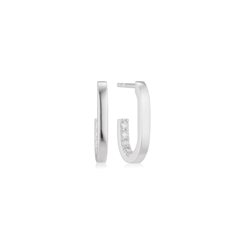 Silver hoop earrings with small diamonds on a white background