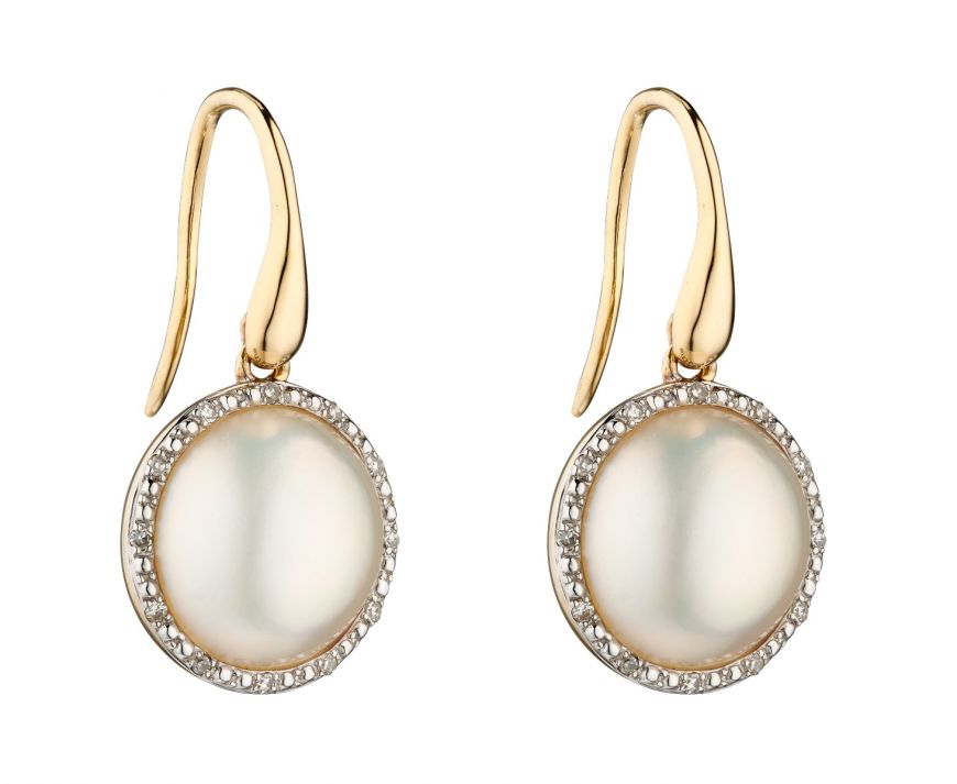 Gold earrings with round white stones on a white background