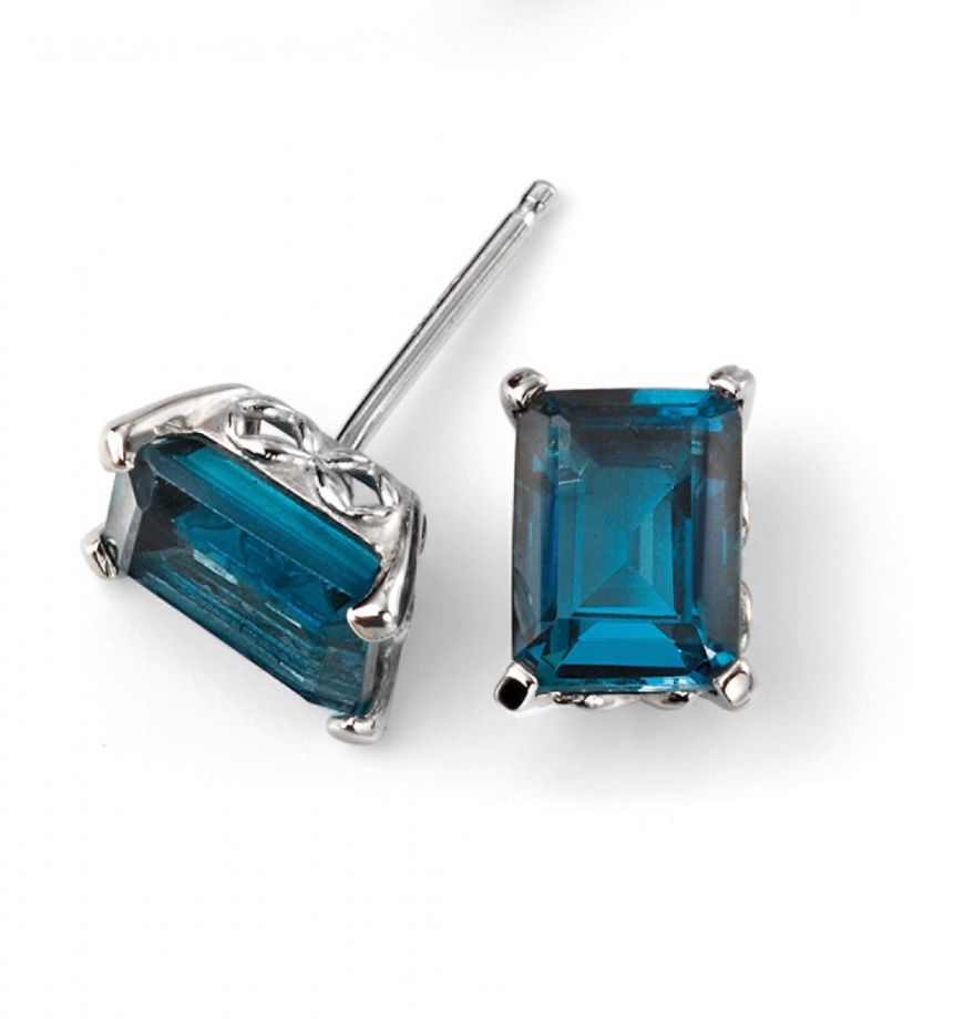 Pair of blue gemstone earrings on a white background
