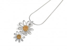 Necklace with daisy flower pendants on a white background
