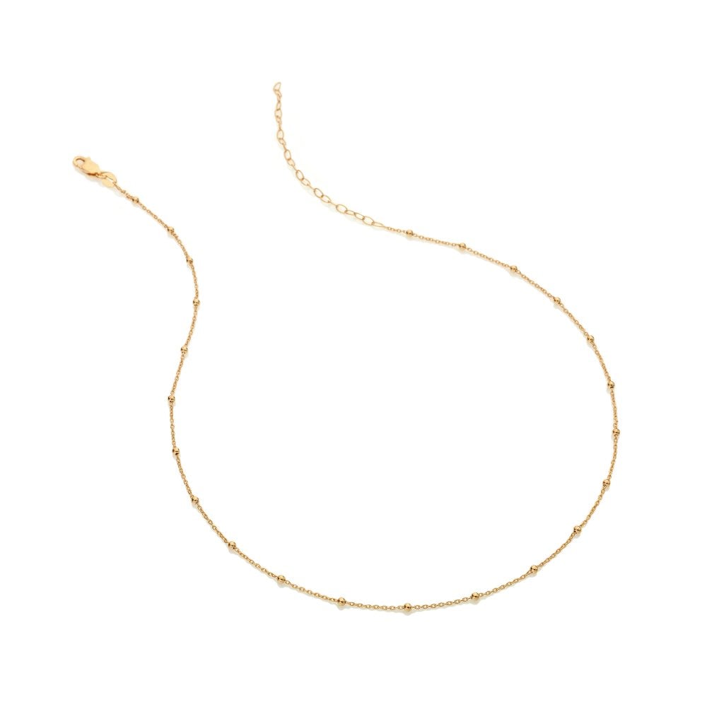 Gold necklace on a white background