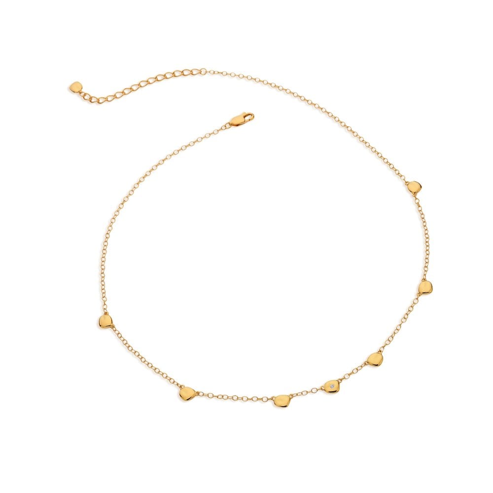 Gold necklace with small heart-shaped pendants on a white background