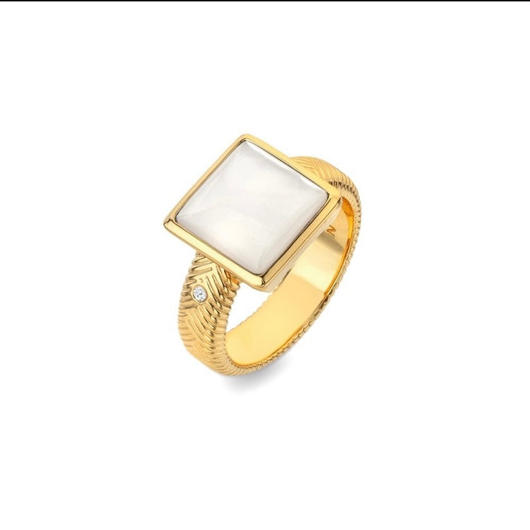 Gold ring with a white square stone on a white background