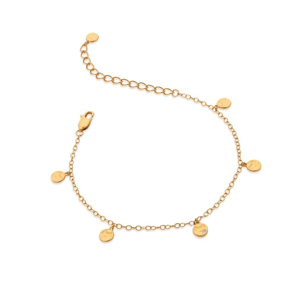 Gold bracelet with round pendants on a white background