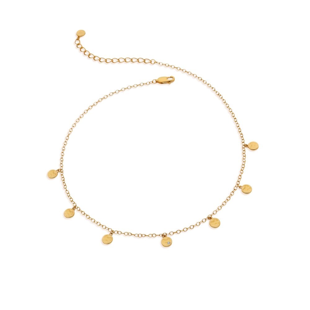 Gold necklace with small round pendants on a white background
