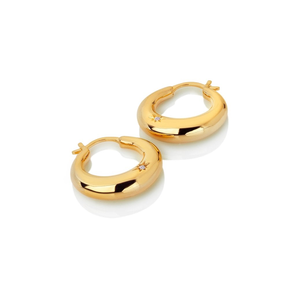 Gold hoop earrings on a white background