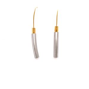 Pair of gold and silver earrings on a white background