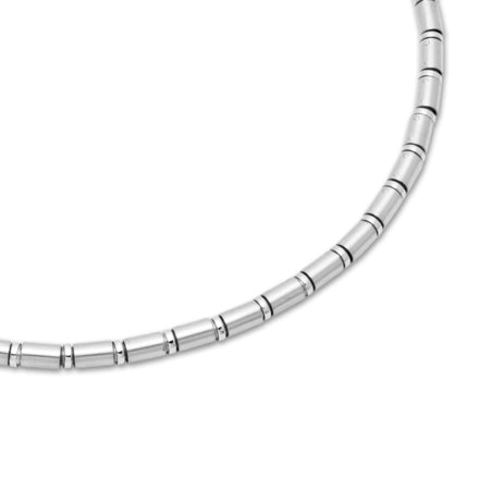 Silver beaded necklace on a white background